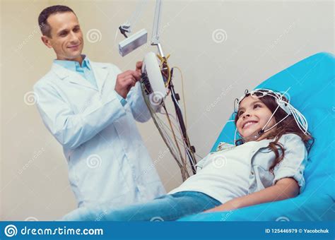 Brave Smiling Girl Undergoing Electroencephalography Procedure Stock Image - Image of hospital ...