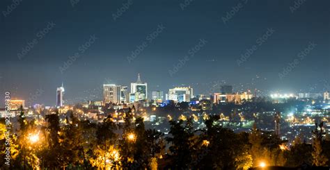 A wide view of Kigali city skyline lit up at night Stock Photo | Adobe Stock