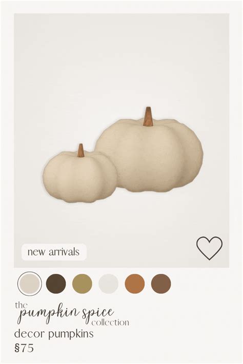 two white pumpkins sitting next to each other on top of a sheet of paper