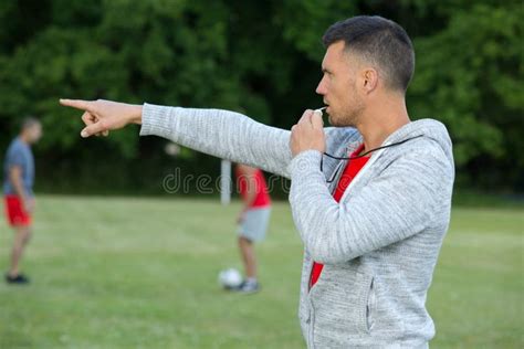 Referee with Whistle at Soccer Game Stock Photo - Image of closeup ...