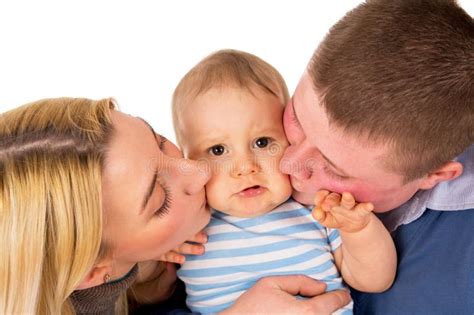 Parents kiss his baby stock image. Image of healthy, mama - 31681503