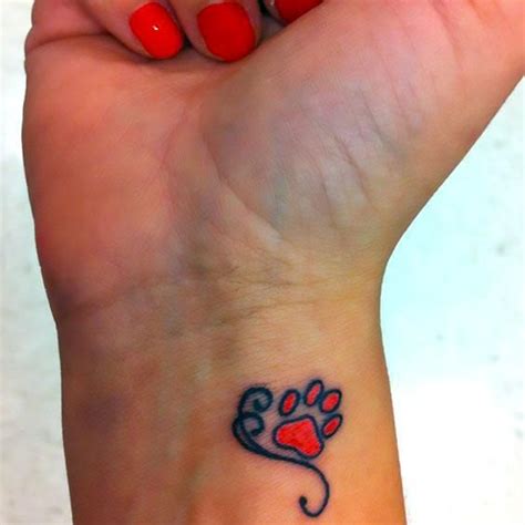 Cute tiny red dog's paw on the wrist. Color: Red. Tags: Cool, Cute, Popular | Pawprint tattoo ...