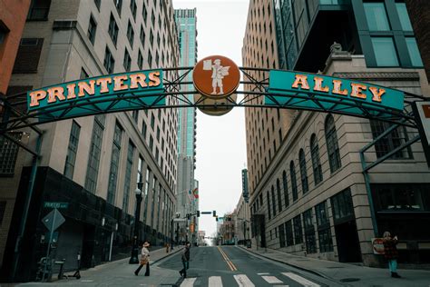 Photo Of Person Walking On Pedestrian Lane · Free Stock Photo