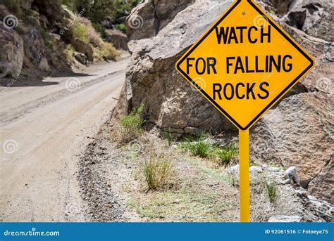 Falling Rocks Danger Warning Road Sign Stock Photo - Image of road, signs: 92061516