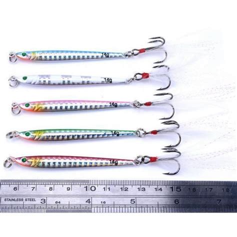 four different types of fishing lures are shown in front of a measuring ...