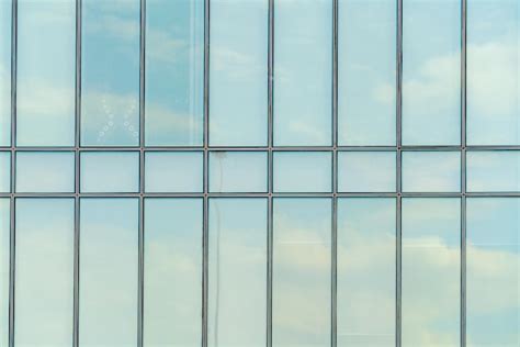 Premium Photo | Glass facade of a modern building Construction and rental housing