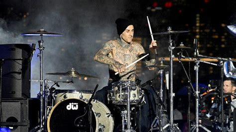 Travis Barker Surprises NYFW With Drum Solo In The Rain | iHeart