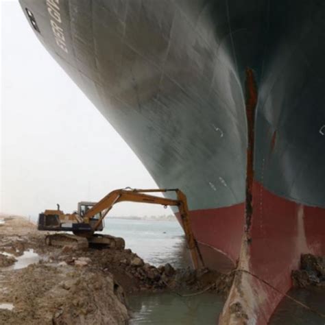 Suez Canal blocked: Tiny digger sent to rescue stuck container ship ...