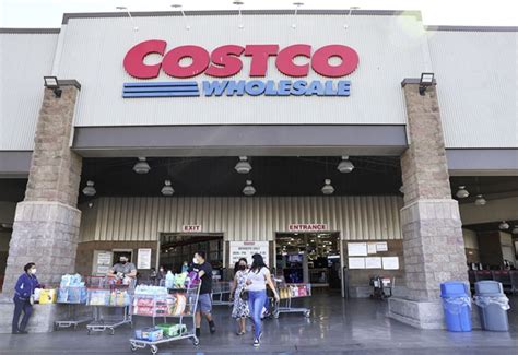 INGLEWOOD, CALIFORNIA – FEBRUARY 25: Shoppers walk in front of a Costco ...