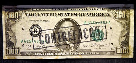 Counterfeit_100_dollar_bill,_dated_1974_but_probably_made_later._over ...