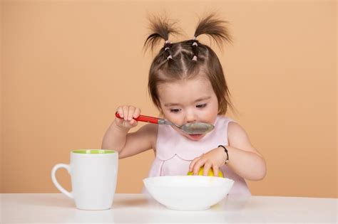 Premium Photo | Cute funny babies eating baby food little baby eating ...