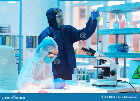 Two Workers Wearing Hazmat Suits in Laboratory Stock Image - Image of ...