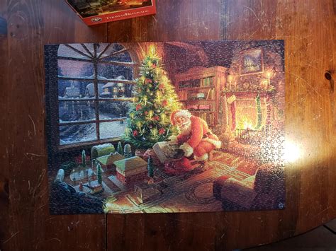 Thomas Kinkade. 1,000 pieces. I got another one, also a Thomas kinkade ...