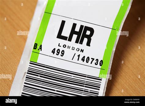 An airline baggage tag shows the three letter airport code for Heathrow ...