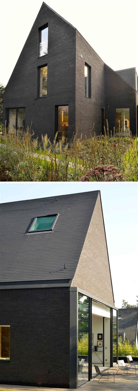 This contemporary black brick house was renovated for a new life in Belgium