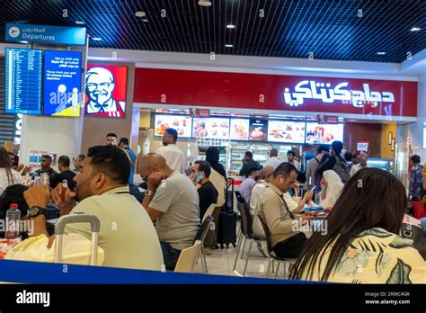 KFC restaurant dubai airport. Food court airport Dubai Stock Photo - Alamy