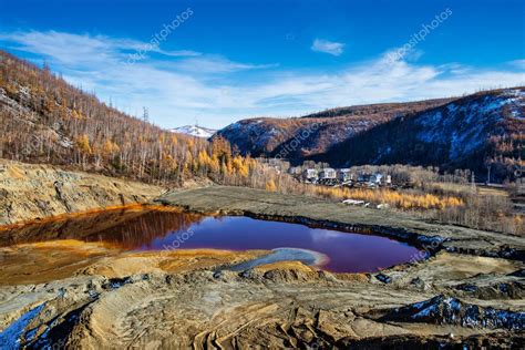 The old tailings pond at the processing plant. — Stock Photo © voldemar992 #87654492