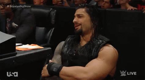 Roman Reigns Laughing GIF - RomanReigns Laughing Sitting - Discover & Share GIFs