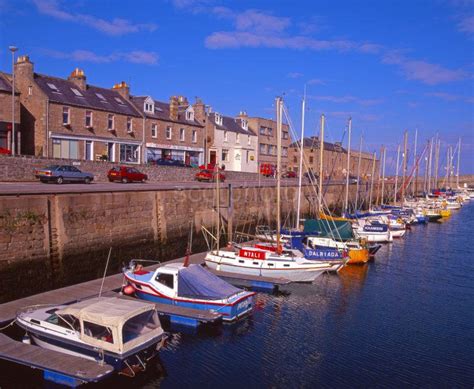 A Colourful Summer Scene In Lossiemouth Harbour Situated On The ...