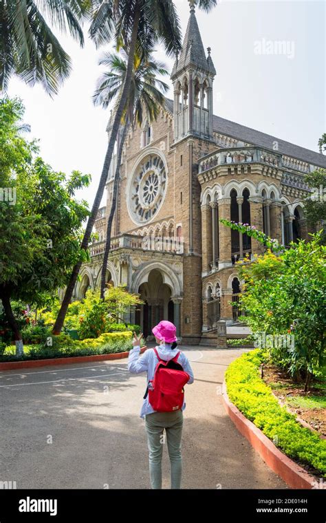 A Chinese tourist at the campus of the University of Mumbai (University of Bombay), one of the ...