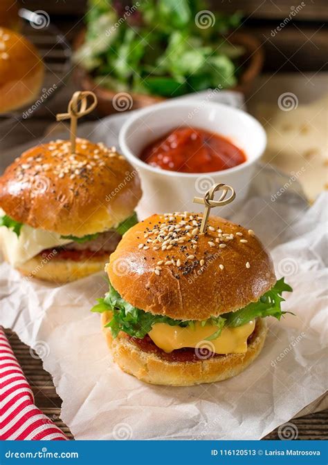 Mini Cheeseburgers Sliders with Ground Beef, Cheddar, Lettuce an Stock Image - Image of sesame ...