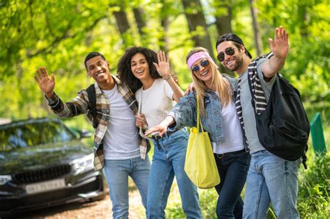 Group of Young People Hitchiking on the Road Stock Photo - Image of freedom, nature: 253755930