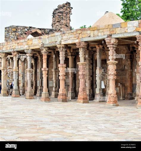 Inside the Qutub Minar Complex with antic ruins and inner square. UNESCO World Heritage in ...