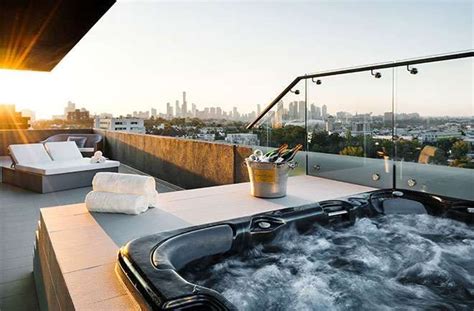 Outdoor balcony with hot tub and a view-- love how this is overlooking ...