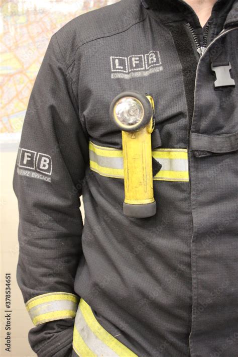 London fire brigade uniform firefighter - LFB, torch Stock Photo ...