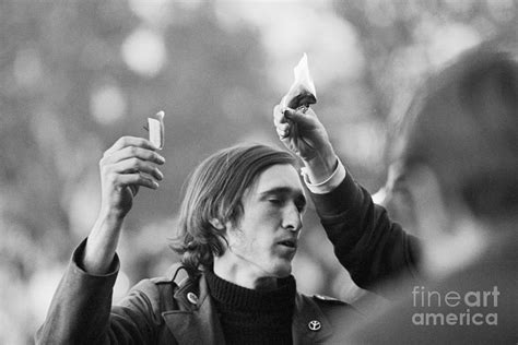 Youth Burning Draft Card At Protest by Bettmann