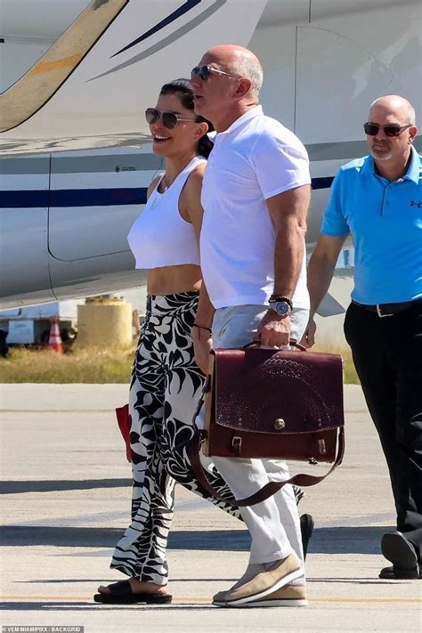 Casually-dressed Jeff Bezos and Lauren Sanchez touch down on private ...