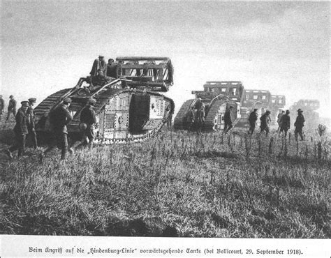 British tanks advancing to attack the German "Hindenburg Line" in 1918. The devices on top the ...