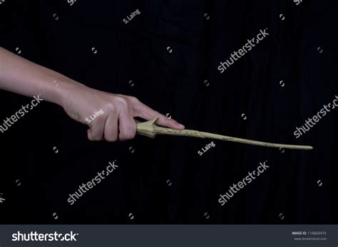 Hand Holding Magic Wand Stock Photo 110669474 - Shutterstock