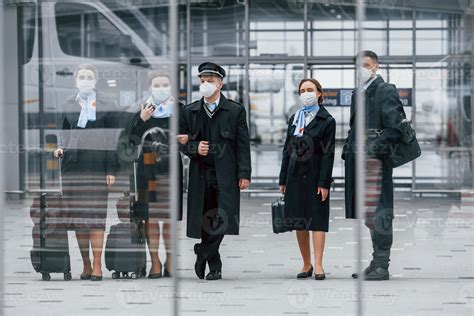 Aircraft crew in work uniform is together outdoors in the airport 15458300 Stock Photo at Vecteezy