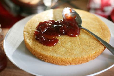 Put one cake top down on to a serving plate (save the better looking ...