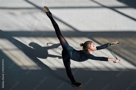 girl making balance rope. rhythmic gymnastics. Stock Photo | Adobe Stock