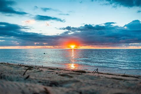 100+ Free Photos - Reddish Sunset in peaceful beach lagoon