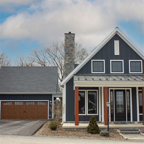 Midnight Blue Farmhouse with Board and Batten Siding | Vinyl siding ...