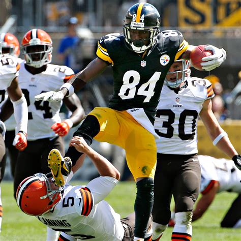 Antonio Brown of Pittsburgh Steelers jump-kicks Cleveland Browns punter ...