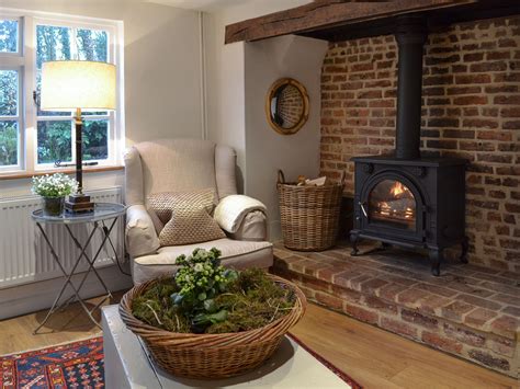 The cottage has a welcoming inglenook fireplace complete with cosy wood ...