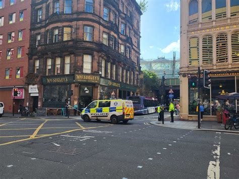 Pedestrian rushed to hospital following bus crash in Glasgow city centre as road remains closed ...