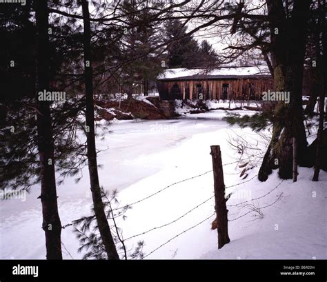 Covered Bridge in Winter Stock Photo - Alamy