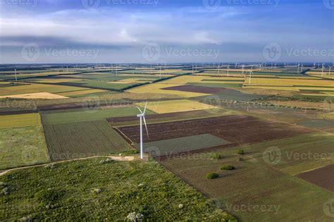 Aerial view at fields and wind turbine farms. Horizontal view 11807452 ...