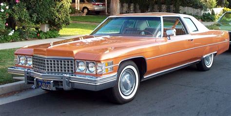 1974 Cadillac Coupe deVille Cabriolet. Finished in Mandarin Orange with White Cabriolet Vinyl ...