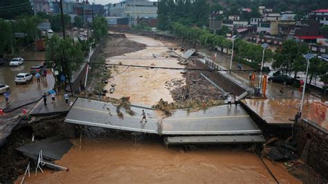 China floods force tens of thousands from their homes as number dead rises to at least 33 ...