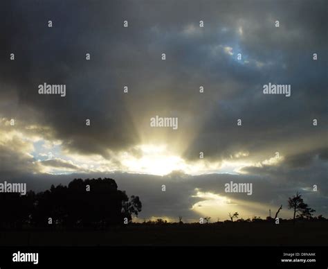 Sun exploding through clouds Stock Photo - Alamy