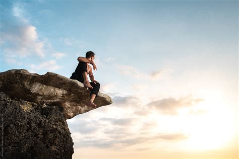 "Man Sitting On A Cliff And Watching Sunset" by Stocksy Contributor ...