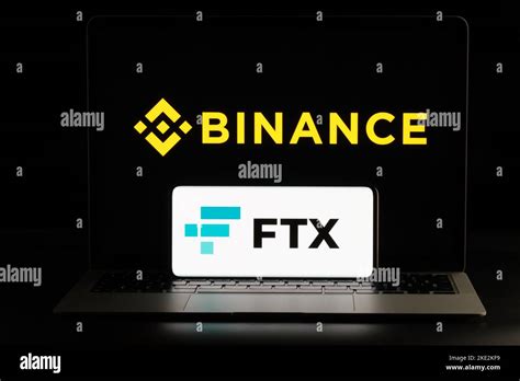 Binance and FTX Cryptocurrency Exchange merger concept. FTX logo seen ...