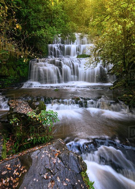 Purakaunui Falls in autumn, Otago, New Zealand - Stock Photo - Dissolve