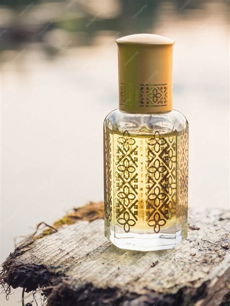 Premium Photo | Arabian oud attar perfume or agarwood oil fragrances in mini bottles.